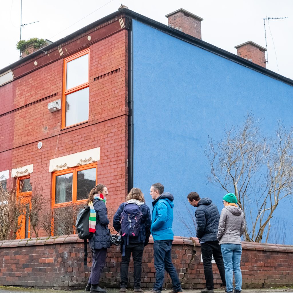 Image of a retrofitted house with external wall insulation in blue.